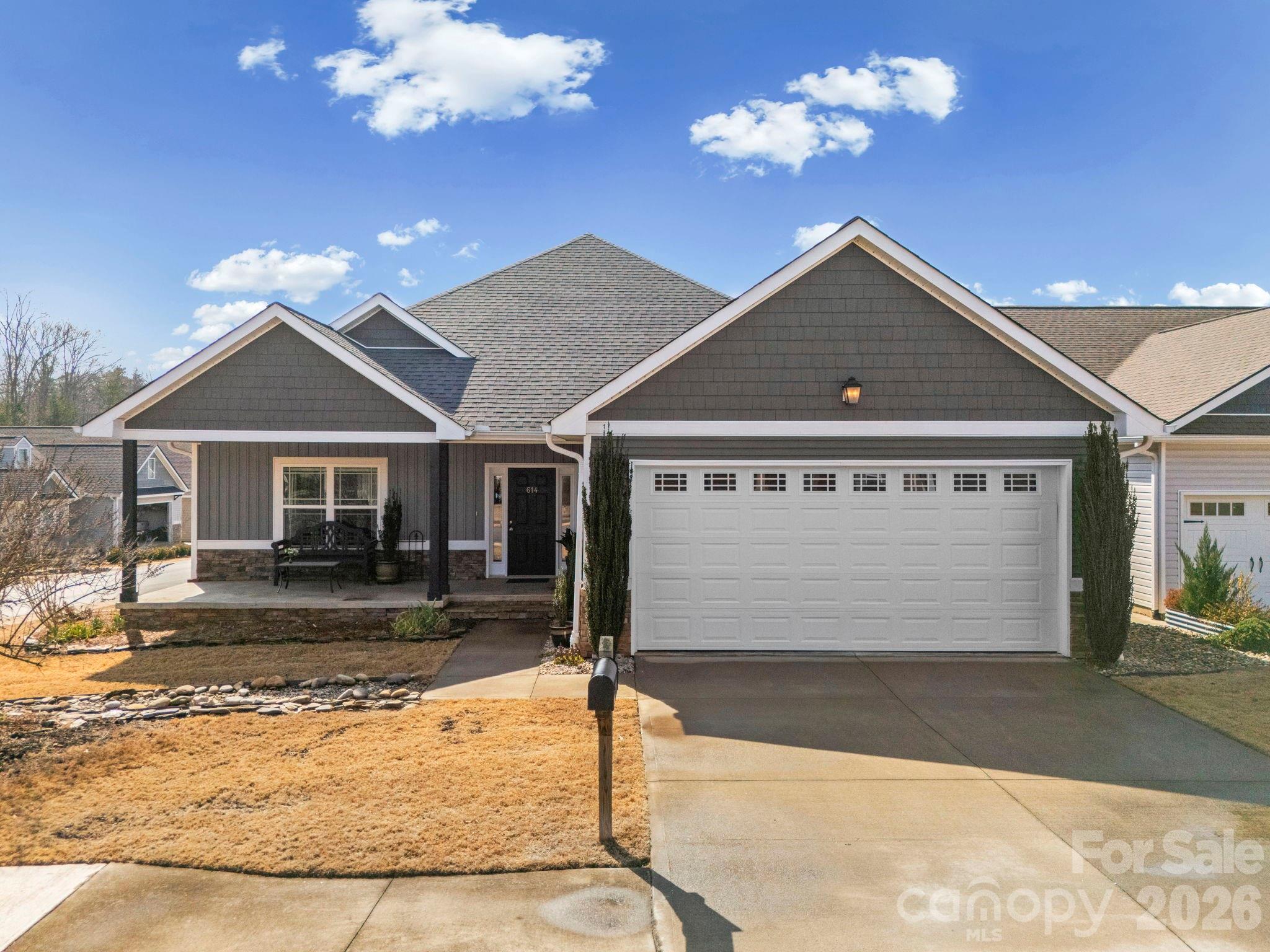 614 Downing Way Landrum, SC 29356 - Photo 1 of 46 a front view of a house with a yard