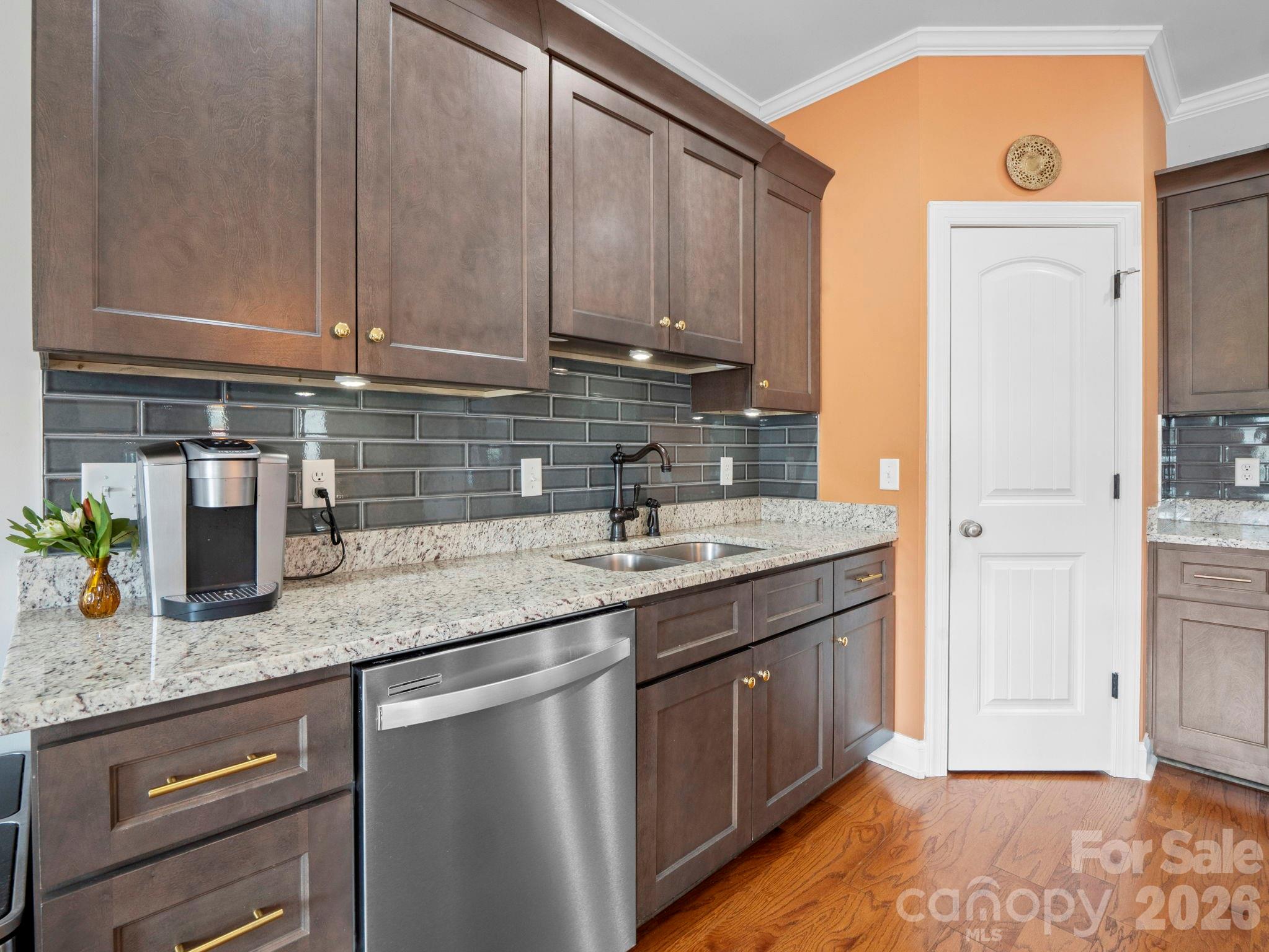 614 Downing Way Landrum, SC 29356 - Photo 14 of 46 a kitchen with stainless steel appliances granite countertop a sink stove and cabinets