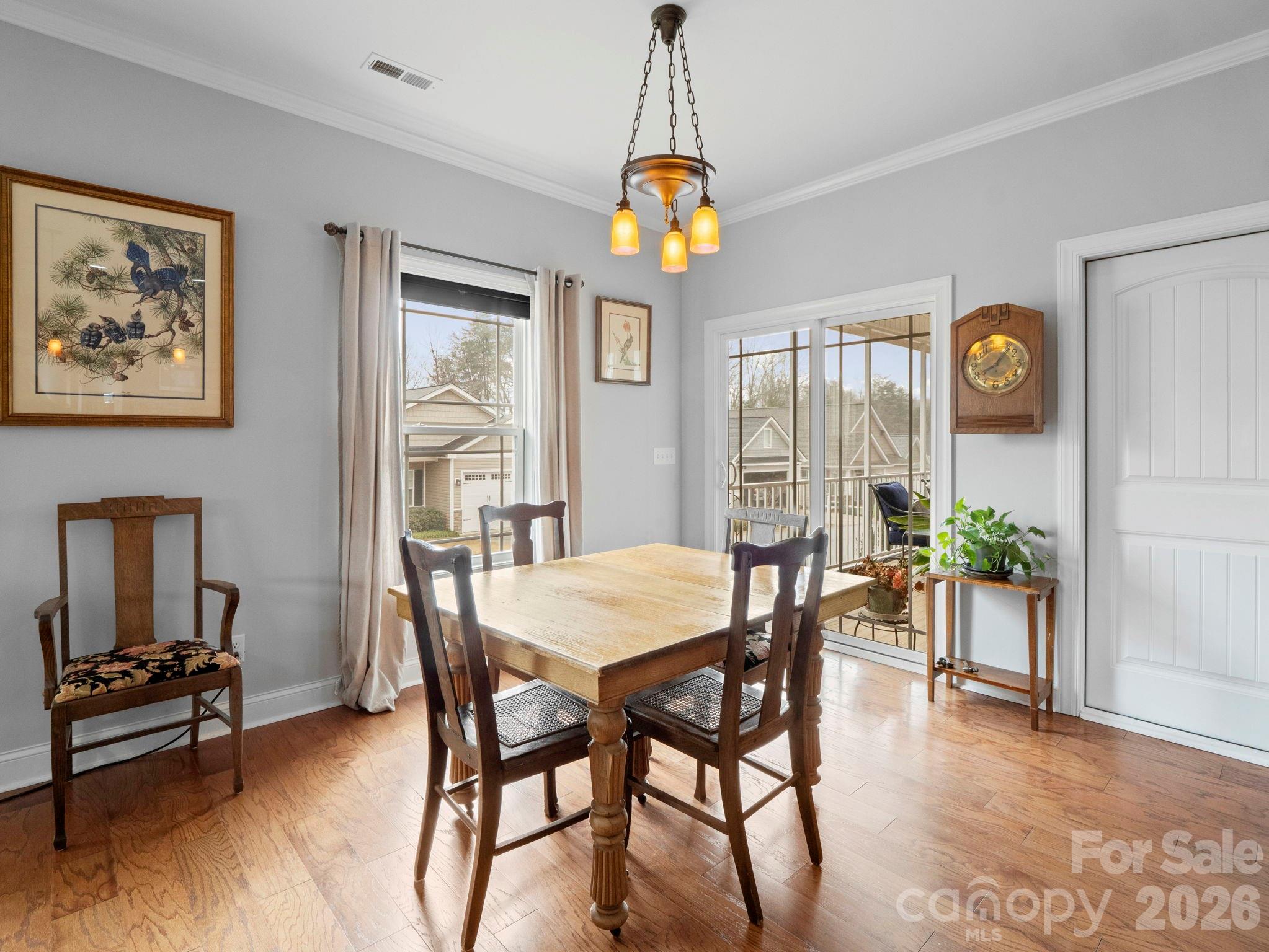 614 Downing Way Landrum, SC 29356 - Photo 17 of 46 a dining room with furniture a livingroom and chandelier