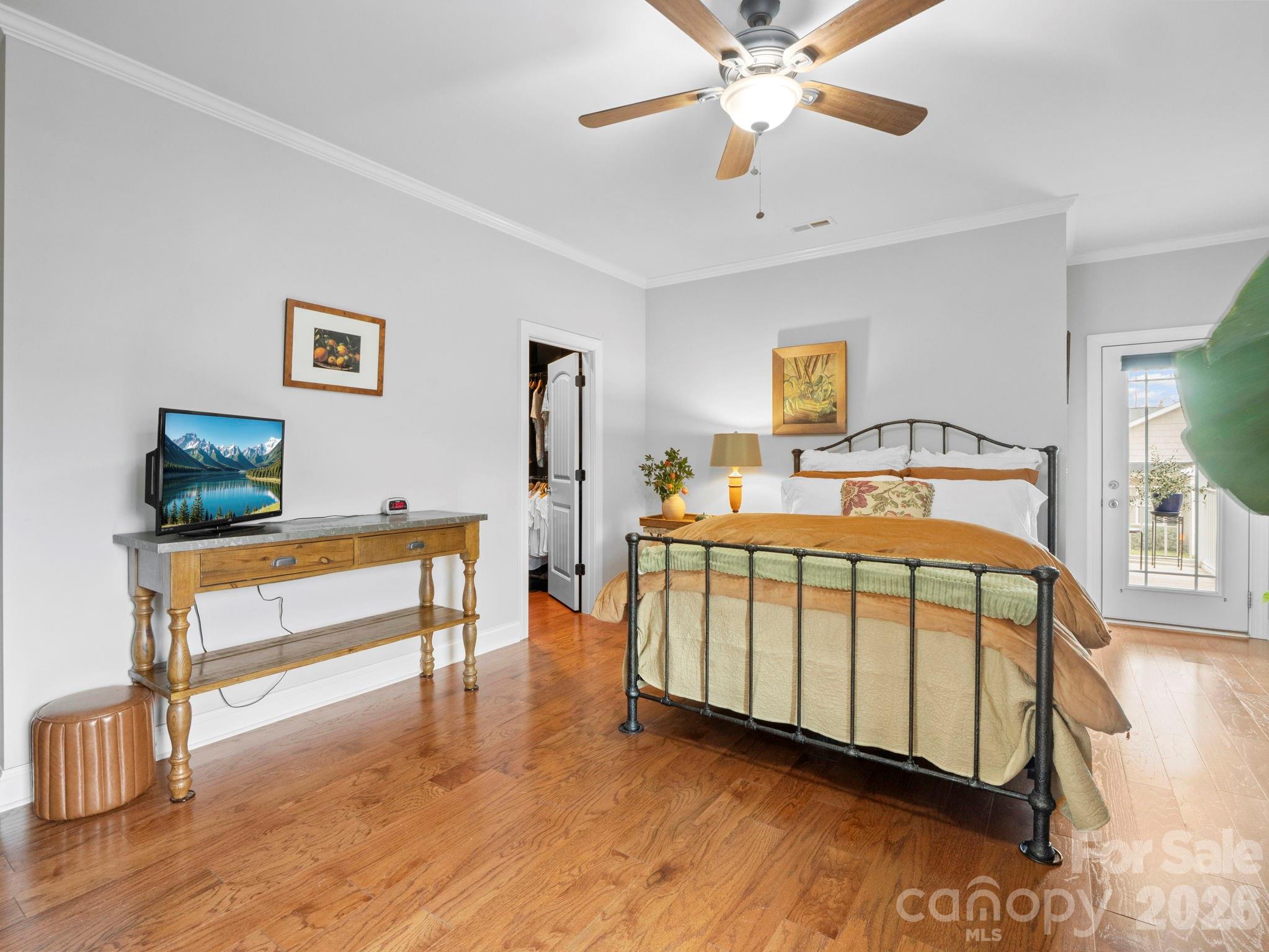 614 Downing Way Landrum, SC 29356 - Photo 20 of 46 a bedroom with a bed and a chandelier