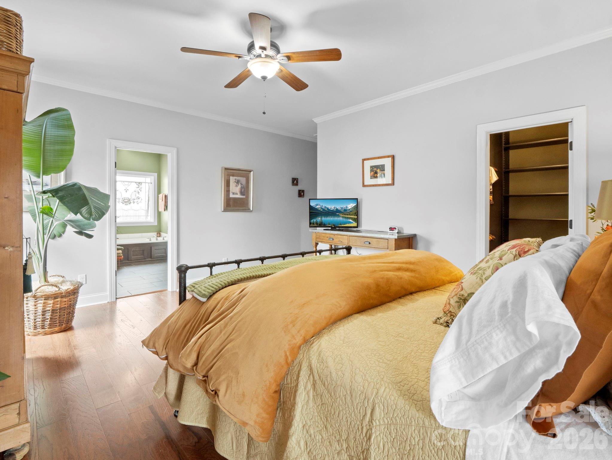 614 Downing Way Landrum, SC 29356 - Photo 21 of 46 a bedroom with a bed and wooden floor