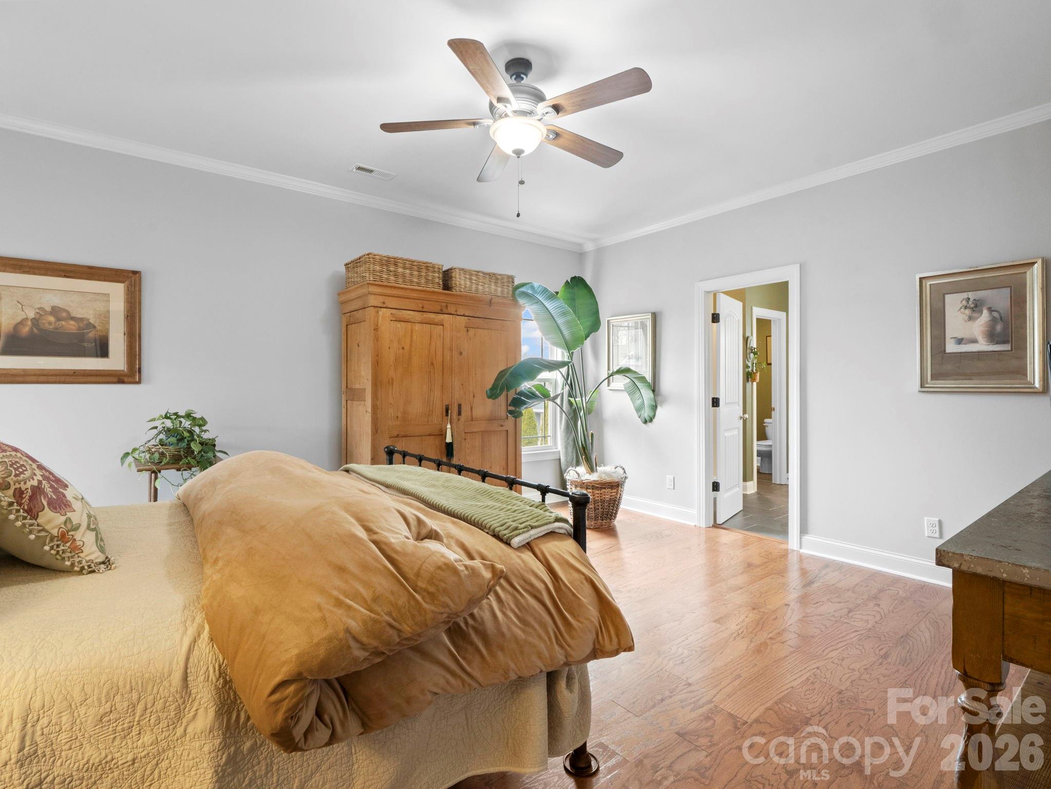 614 Downing Way Landrum, SC 29356 - Photo 22 of 46 a bedroom with a bed and ceiling fan