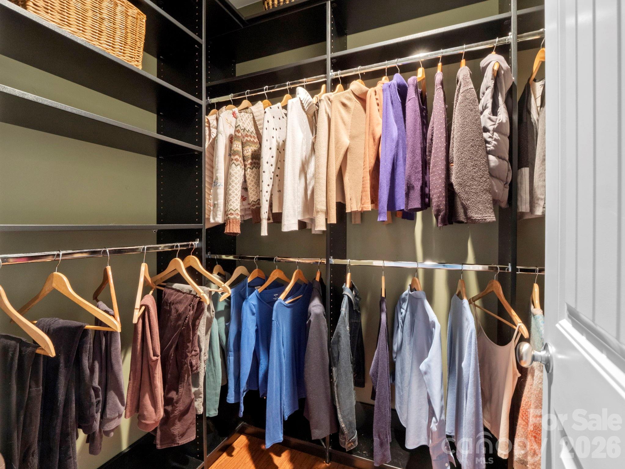 614 Downing Way Landrum, SC 29356 - Photo 23 of 46 a view of walk in closet with clothes