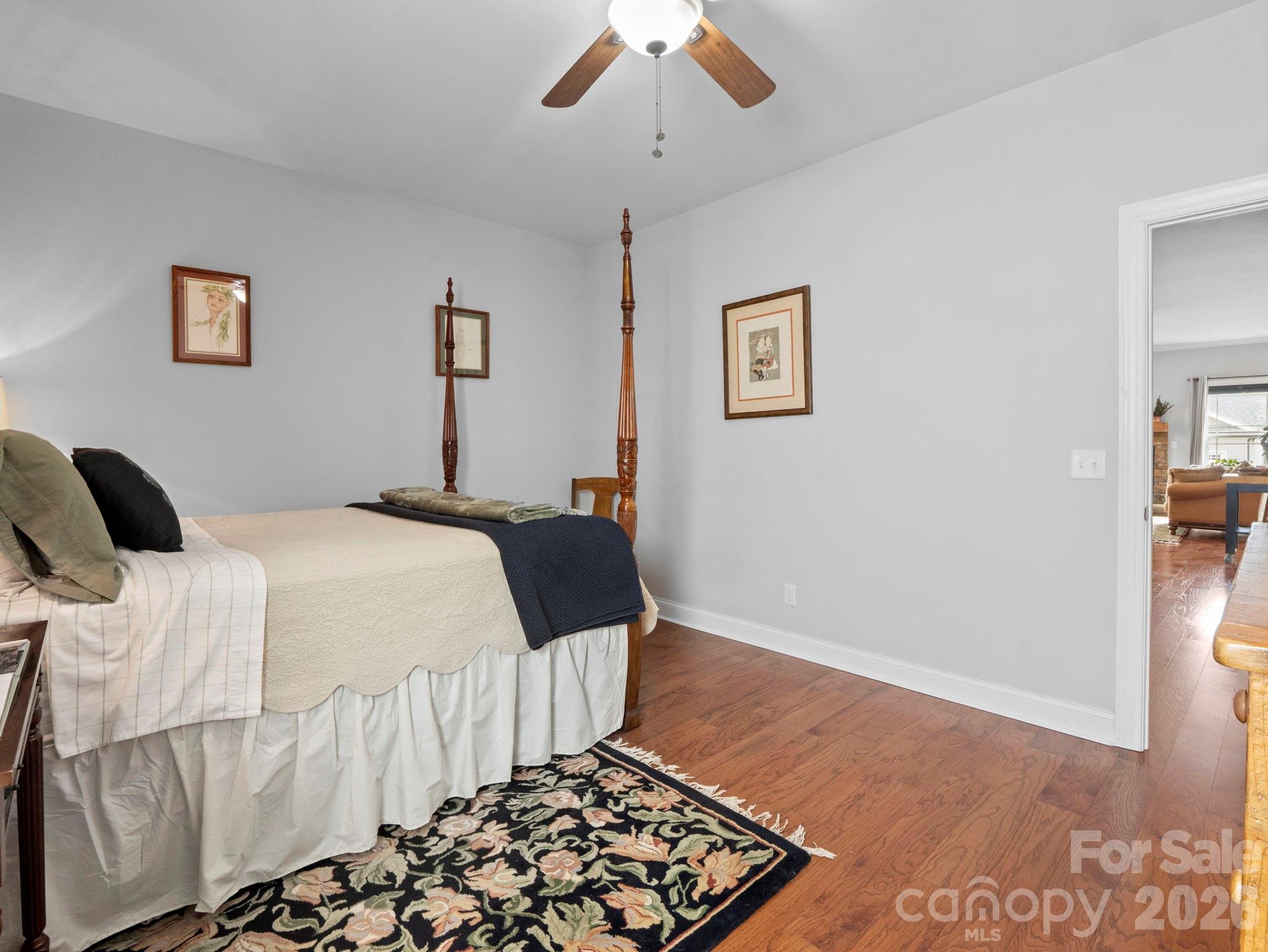 614 Downing Way Landrum, SC 29356 - Photo 28 of 46 a bedroom with a bed and a painting on the wall