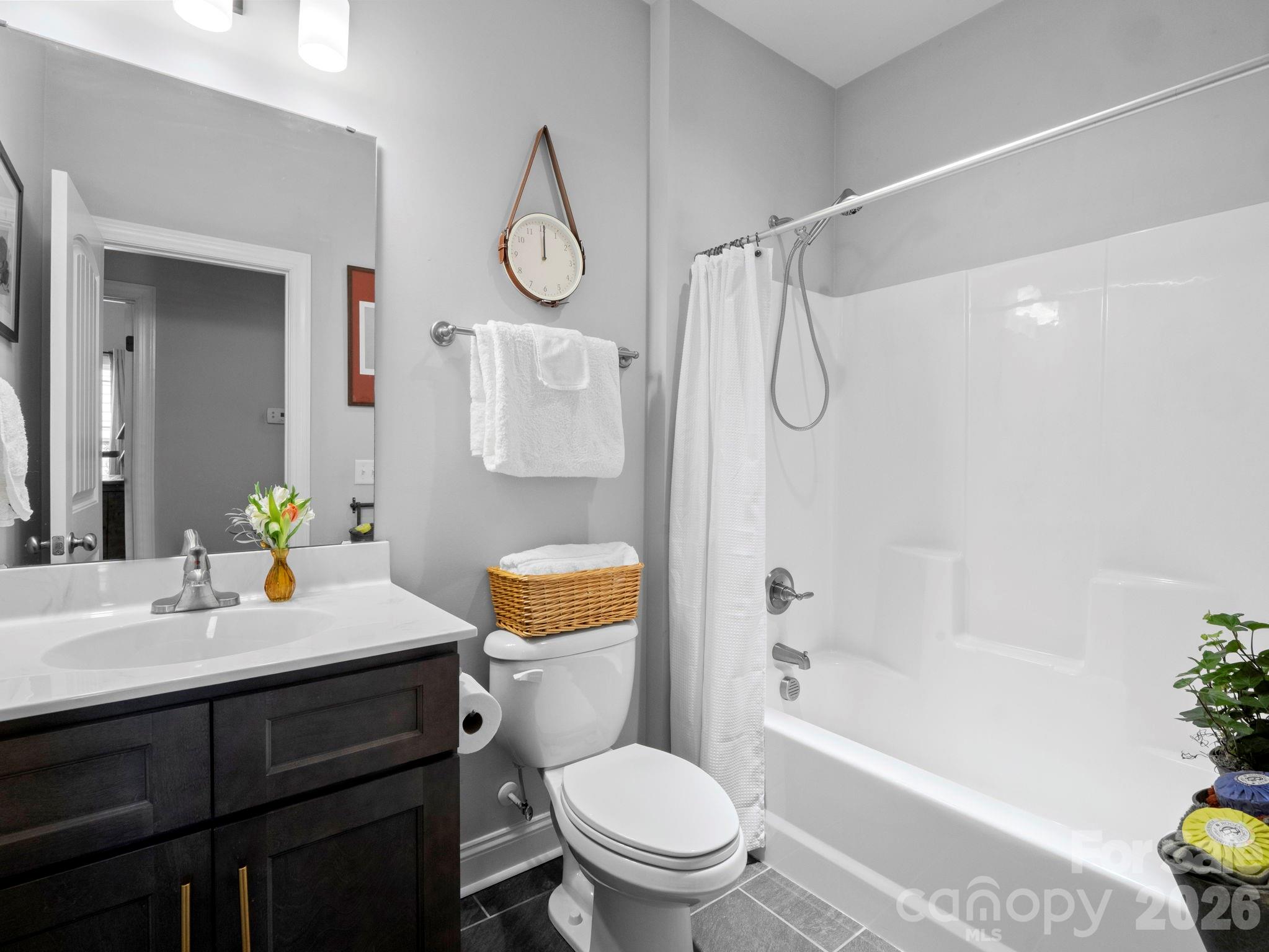 614 Downing Way Landrum, SC 29356 - Photo 30 of 46 a bathroom with a sink toilet vanity and shower