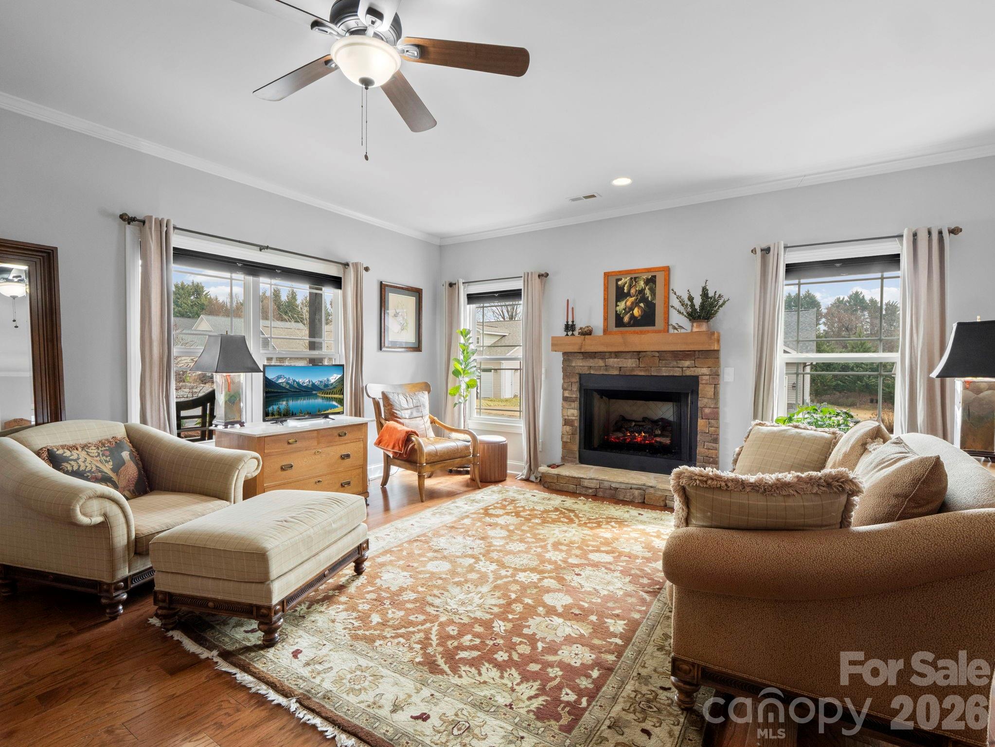 614 Downing Way Landrum, SC 29356 - Photo 9 of 46 a living room with furniture large window and a fireplace