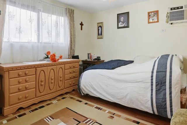 a bed room with two beds and a window