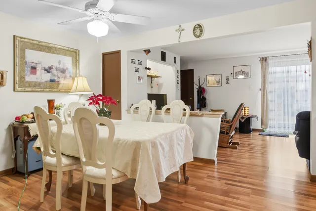 a view of a dining room with furniture and wooden floor