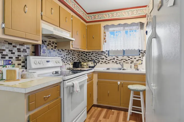 a kitchen with a sink and cabinets