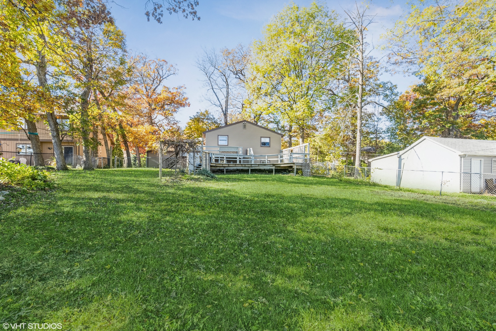 81 Tweed Road Fox Lake, IL 60020 - Photo 2 of 15 a view of a large garden with plants and large trees
