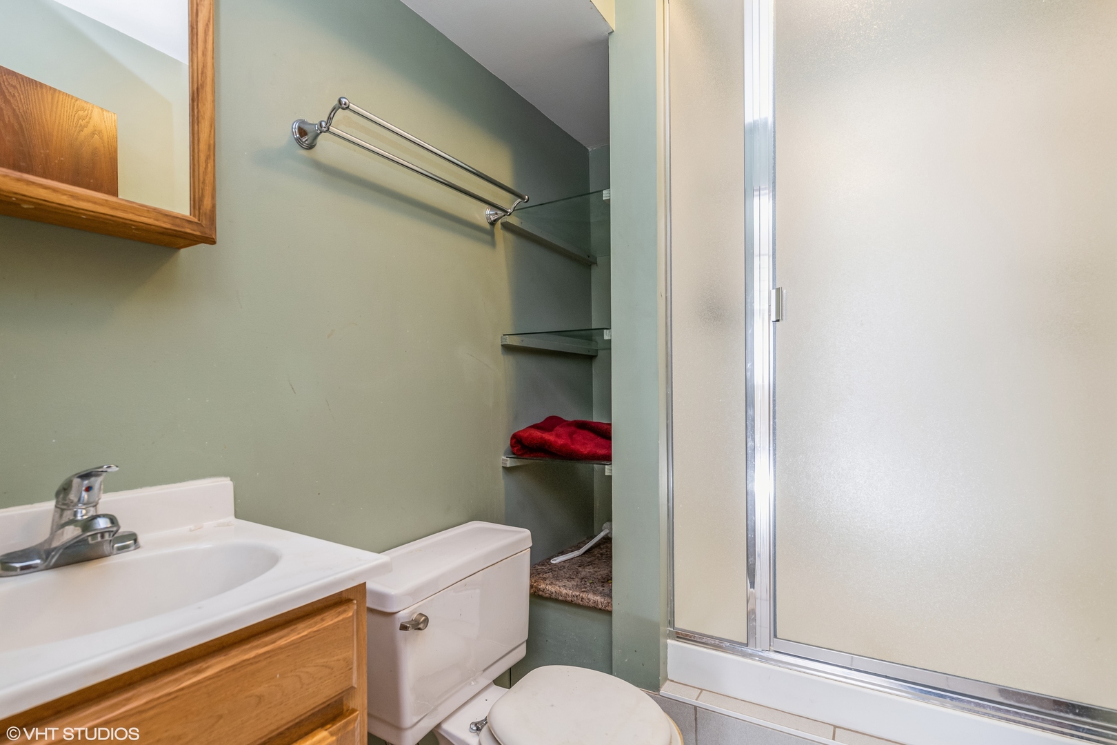 81 Tweed Road Fox Lake, IL 60020 - Photo 14 of 15 a white toilet sitting next to a bathroom sink