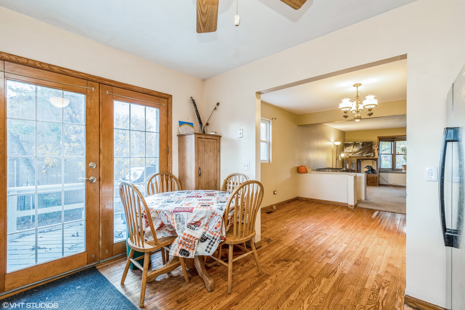 81 Tweed Road Fox Lake, IL 60020 - Photo 7 of 15 a view of a dining room with furniture and a chandelier