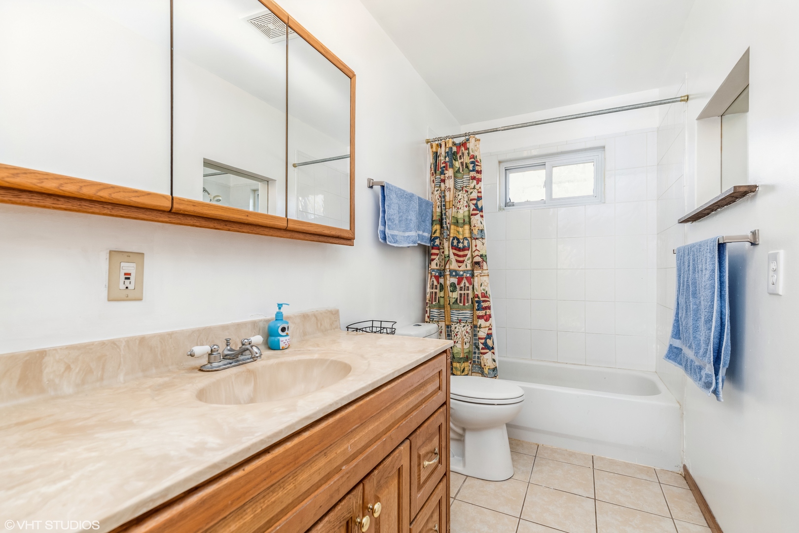 81 Tweed Road Fox Lake, IL 60020 - Photo 10 of 15 a bathroom with a granite countertop sink a toilet a mirror and shower