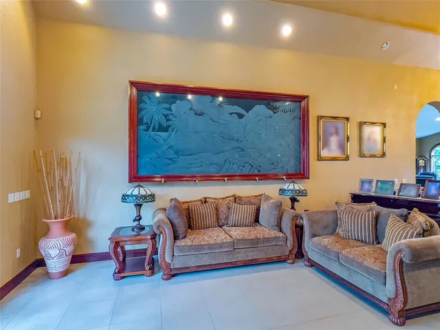 a living room with furniture and a rug