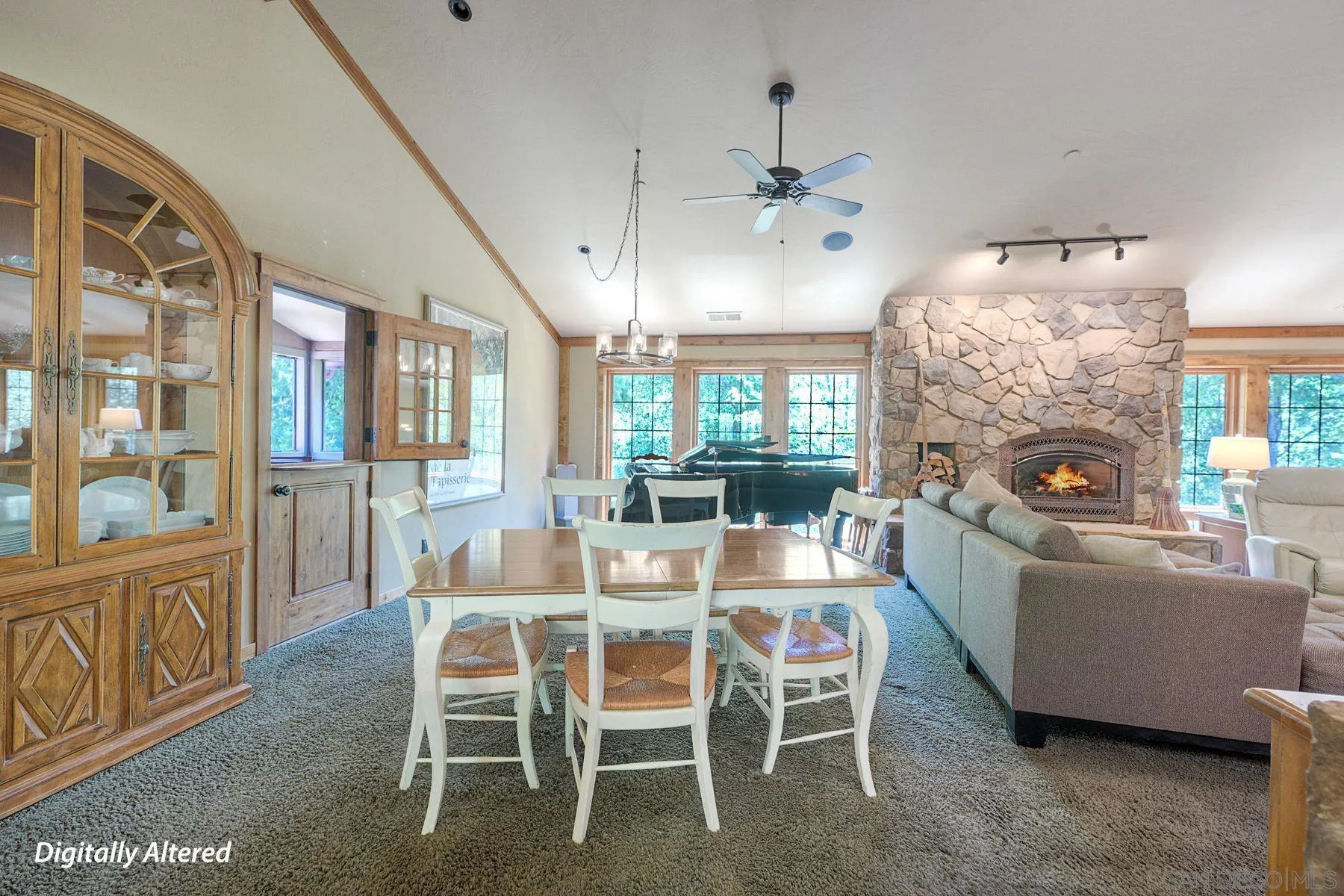 1055 West Incense Cedar Road Julian, CA 92036 - Photo 11 of 56 a dining room with furniture a livingroom and chandelier