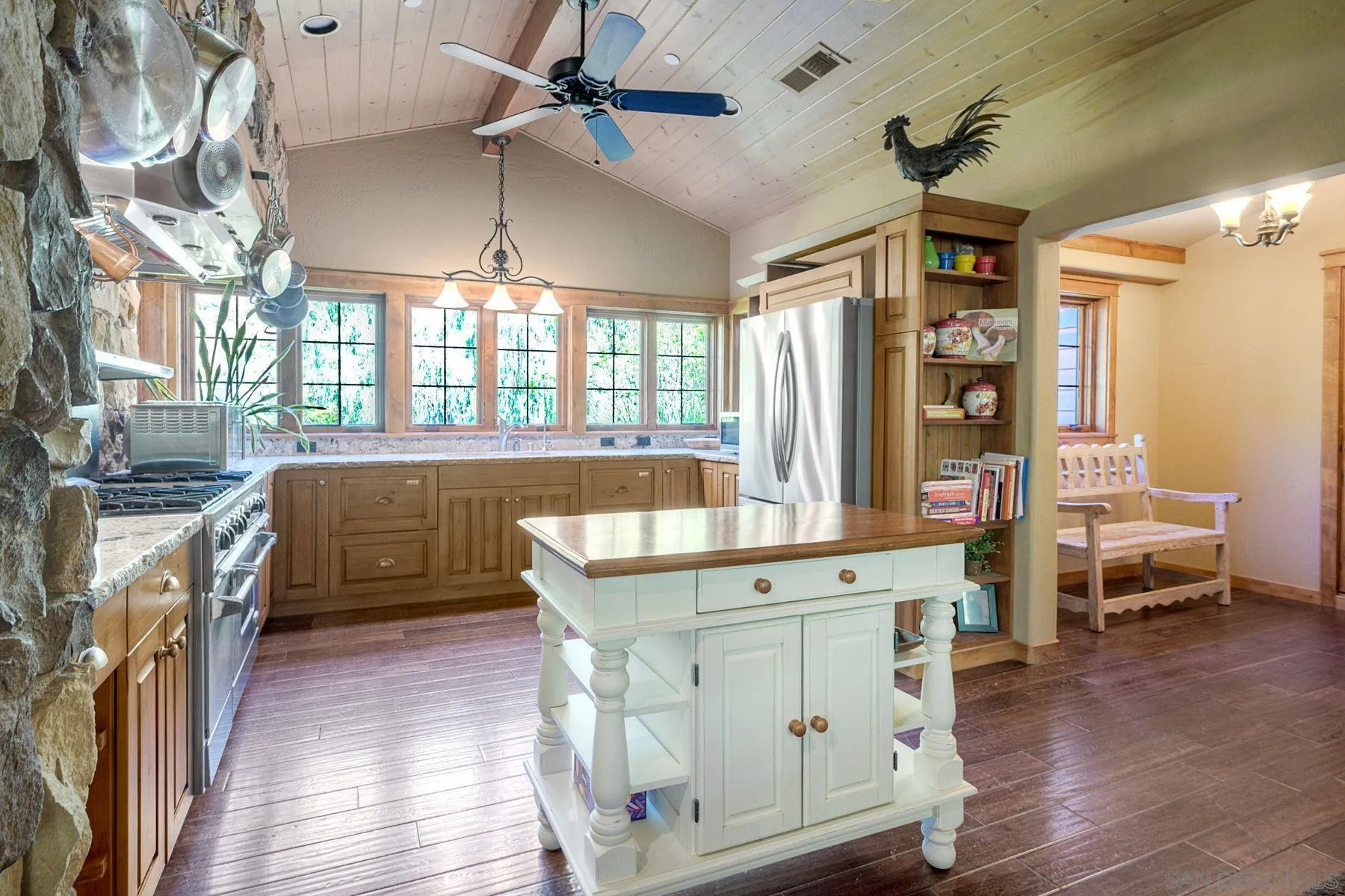 1055 West Incense Cedar Road Julian, CA 92036 - Photo 13 of 56 a kitchen that has a lot of cabinets in it