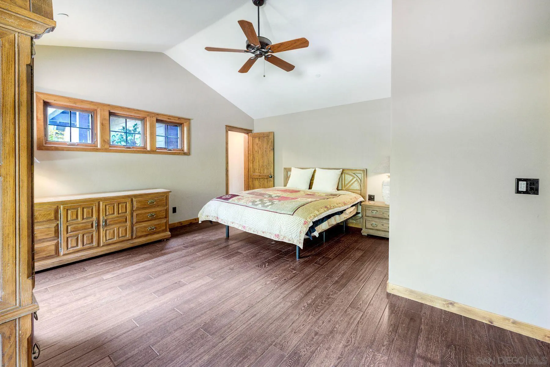1055 West Incense Cedar Road Julian, CA 92036 - Photo 36 of 56 a bedroom with a bed and a chandelier