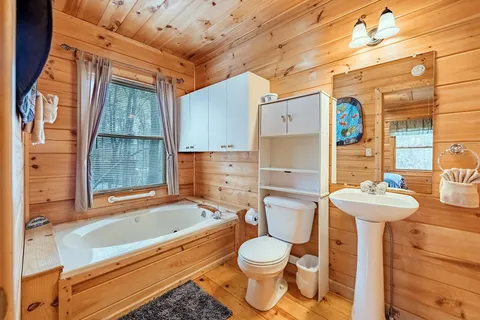 a bathroom with a bathtub and shower