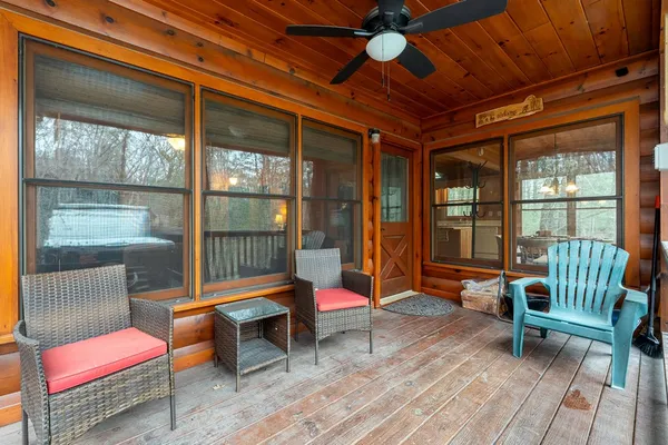 a backyard of a house with barbeque oven table and chairs