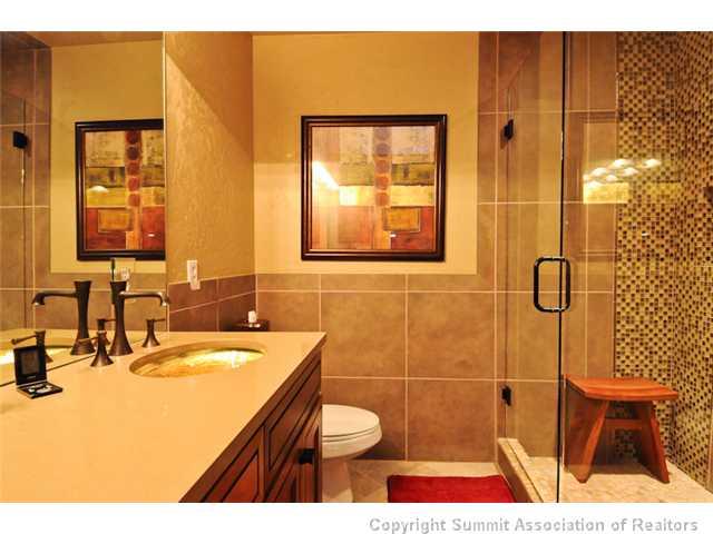 487 Main Street, Unit D Frisco, CO 80443 - Photo 11 of 25 a bathroom with a sink toilet and shower