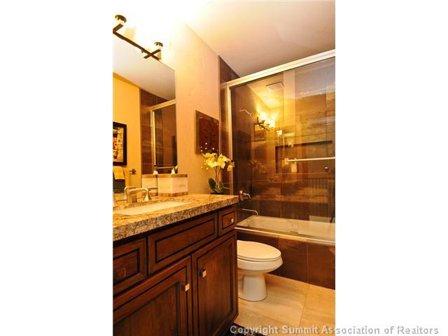 487 Main Street, Unit D Frisco, CO 80443 - Photo 17 of 25 a bathroom with a sink a toilet and shower
