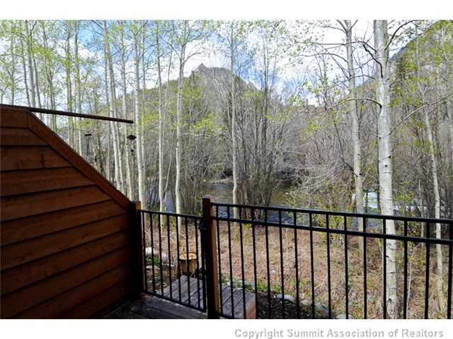 487 Main Street, Unit D Frisco, CO 80443 - Photo 19 of 25 a view of a balcony with wooden fence and floor