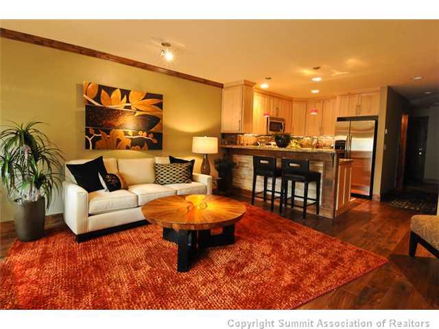 487 Main Street, Unit D Frisco, CO 80443 - Photo 4 of 25 a living room with furniture and a dining table