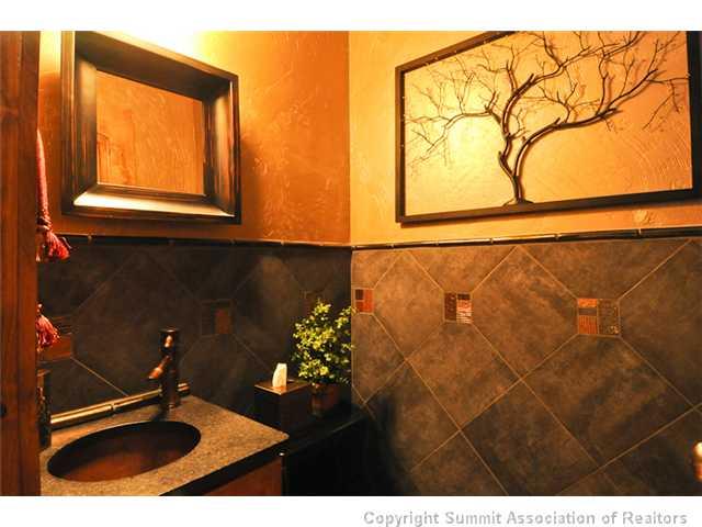 487 Main Street, Unit D Frisco, CO 80443 - Photo 7 of 25 a bathroom with a sink and a mirror