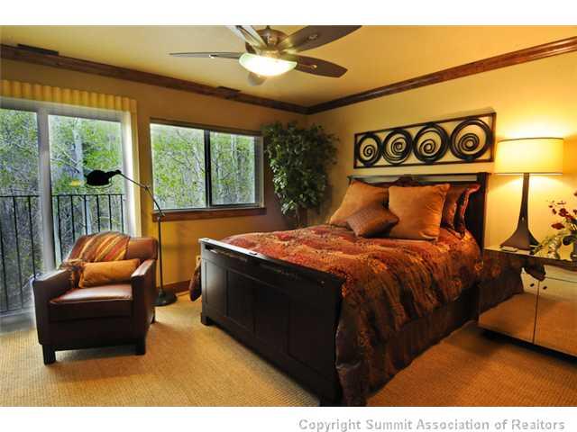 487 Main Street, Unit D Frisco, CO 80443 - Photo 8 of 25 a bedroom with furniture and a large window