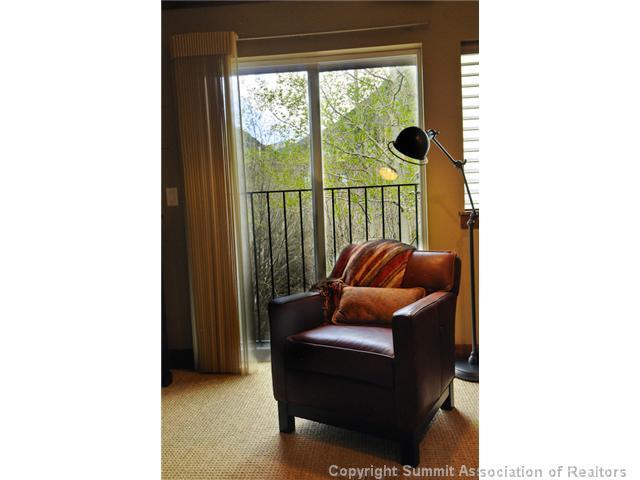 487 Main Street, Unit D Frisco, CO 80443 - Photo 10 of 25 a living room with furniture and a window