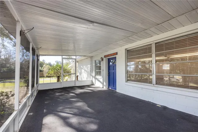 a view of a room with large windows
