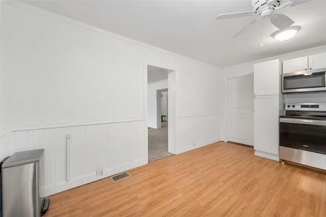 a bedroom with a bed and cabinets