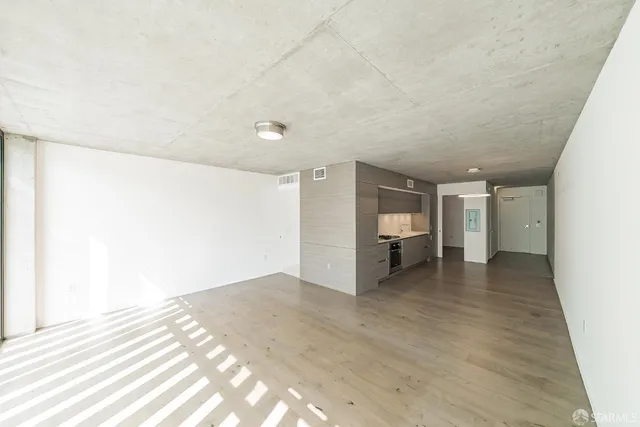 a view of a kitchen with a stove top oven