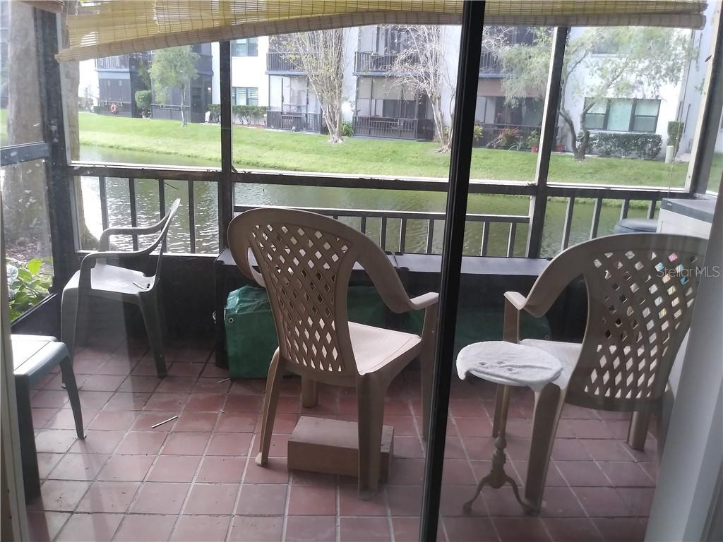 a view of a chairs and table in the patio