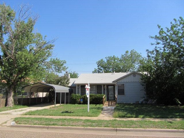 2412 36th Street Lubbock, TX 79412 - Photo 1 of 10 a front view of a house with a yard