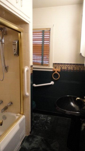 2412 36th Street Lubbock, TX 79412 - Photo 5 of 10 a bathroom with a bathtub and a sink