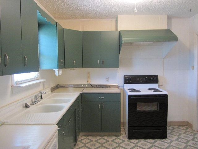 2412 36th Street Lubbock, TX 79412 - Photo 10 of 10 a kitchen with a sink and a stove