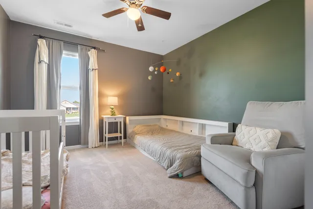 a living room with furniture and chandelier