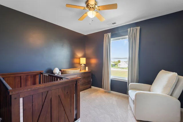 a bedroom with furniture and window