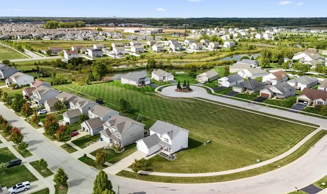 a view of a swimming pool with a lot of trees in the background