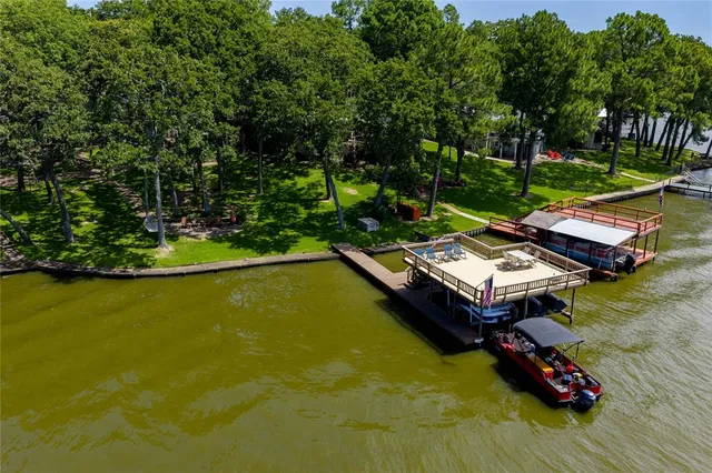 a small pool with some trees in the background