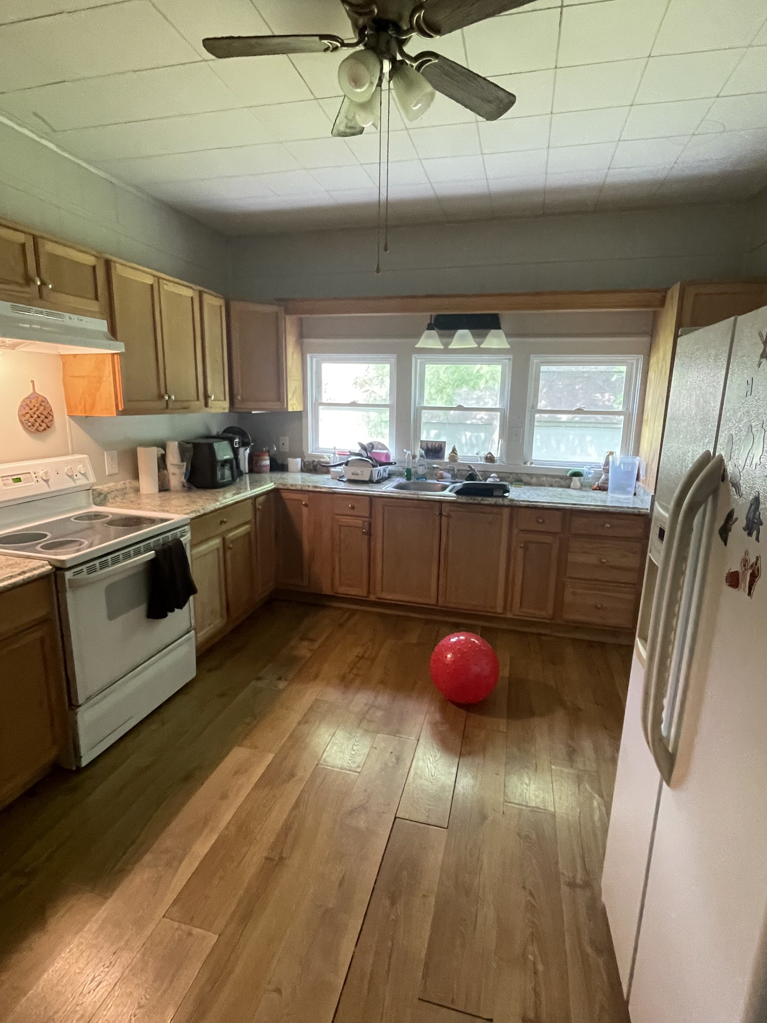 2034 Tennessee Street Westpoint, TN 38486 - Photo 8 of 9 a kitchen with stainless steel appliances granite countertop a sink a stove top oven a counter space and cabinets