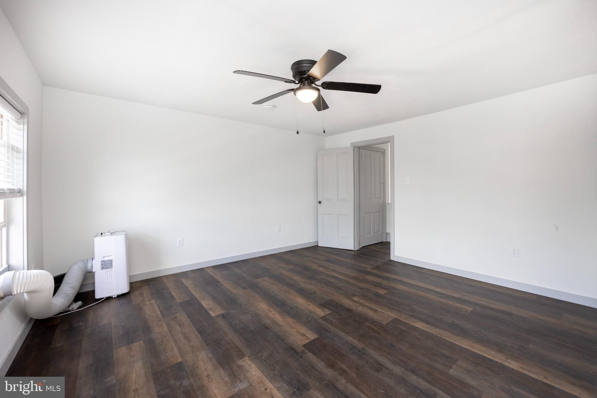 58 East 4th Street, Unit 2 Bridgeport, PA 19405 - Photo 16 of 28 a view of empty room with wooden floor and fan
