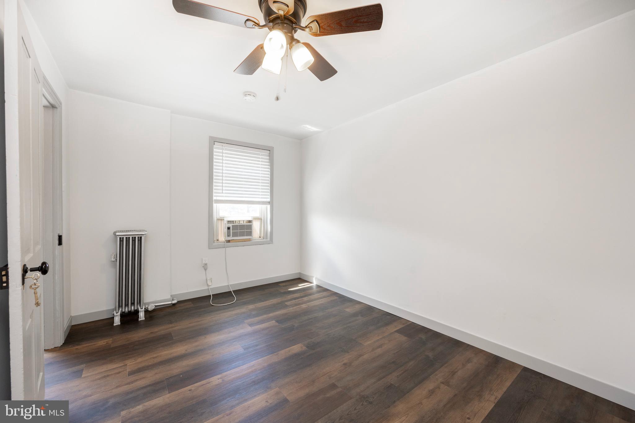 58 East 4th Street, Unit 2 Bridgeport, PA 19405 - Photo 19 of 28 wooden floor in an empty room with a window