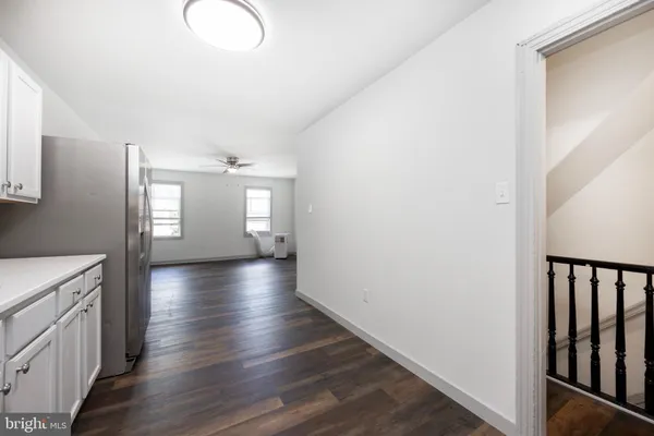 a view of entryway with stairs and wooden floor