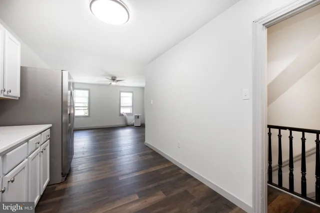 a view of entryway with stairs and wooden floor