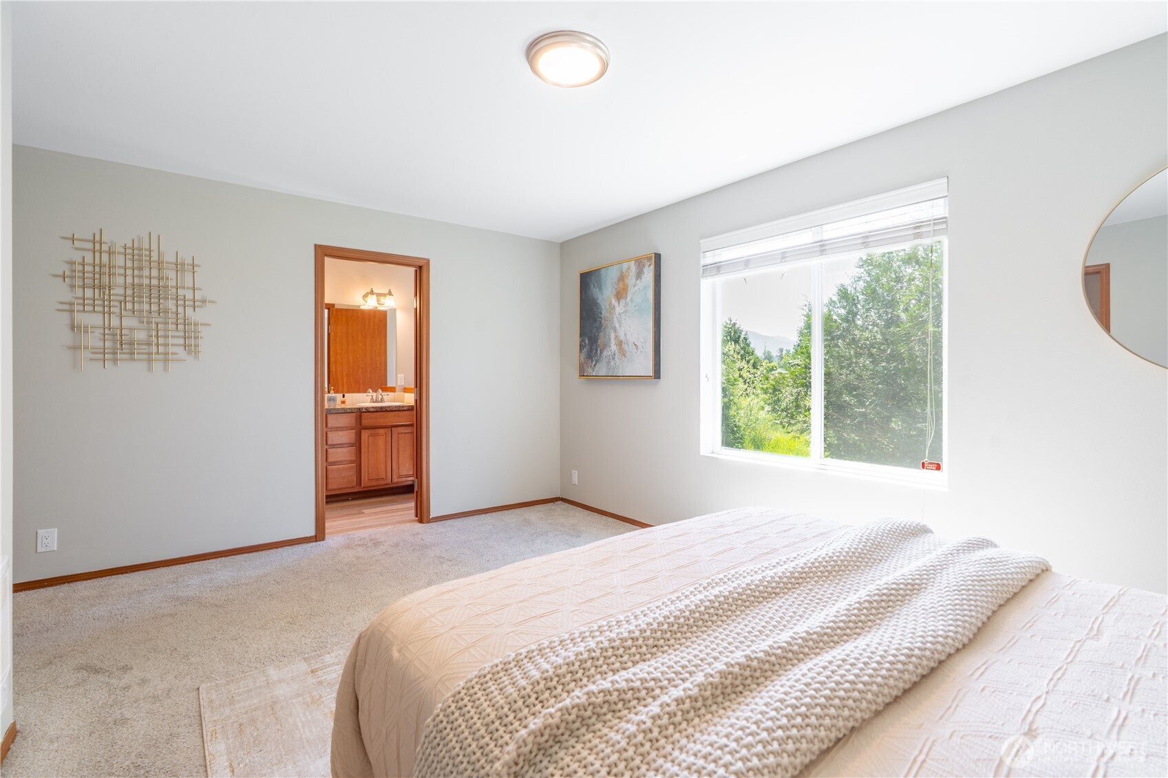 242 Riggs Drive East Enumclaw, WA 98022 - Photo 24 of 40 a bedroom with a bed and a window