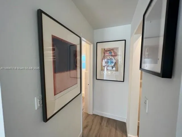 a view of front door with wooden floor