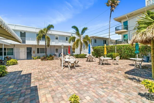 a view of a building with sitting area