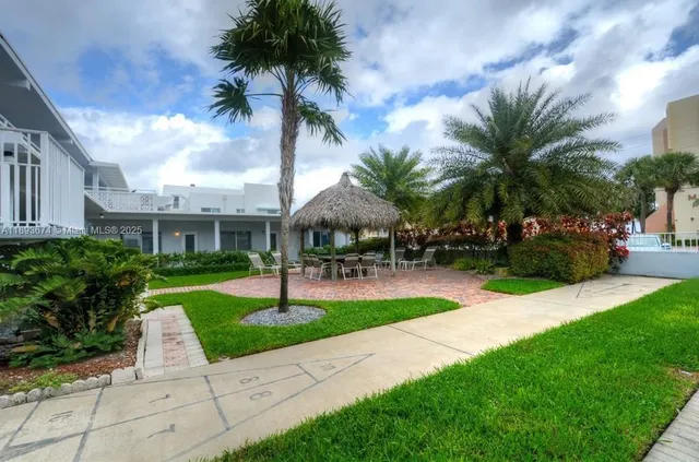 a view of a backyard with a garden and plants